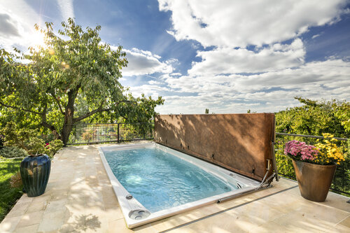 USSPA swim spa – premium all-season pool with a safe cover for kids and pets.
