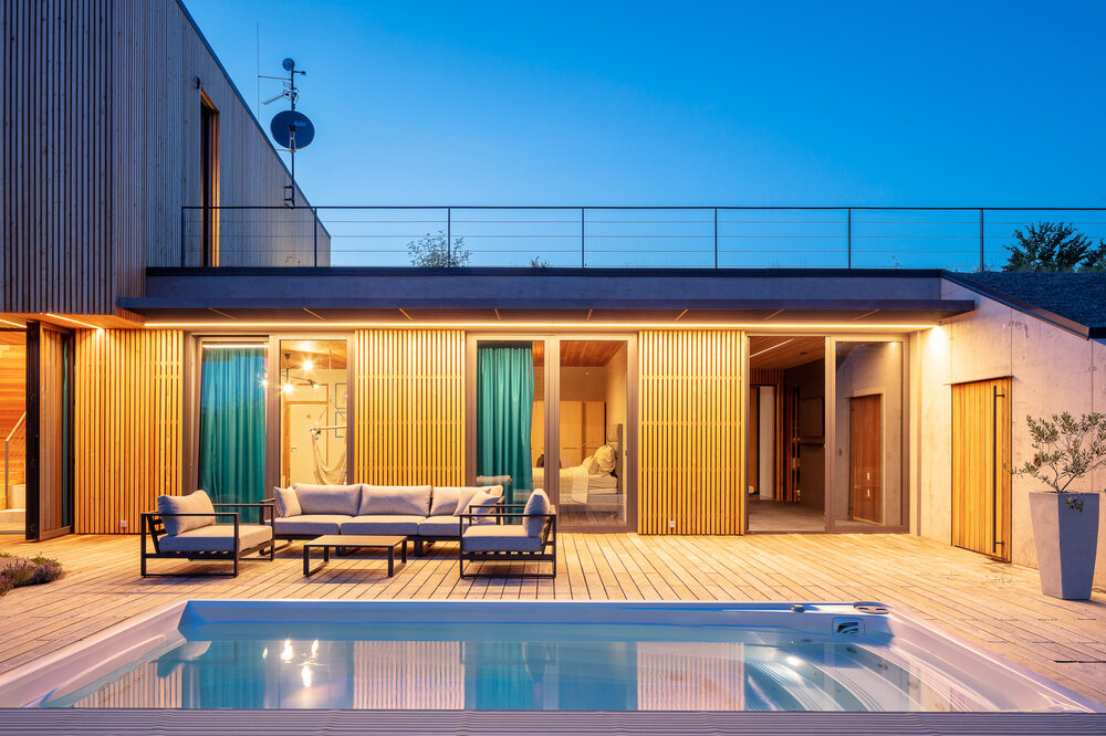 Designer home with USSPA Swim Spa XL – inspiration for placing a premium all-season pool.