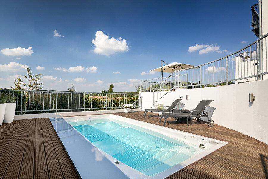 USSPA Swim Spa – premium all-season pool on a family home terrace for relaxation.