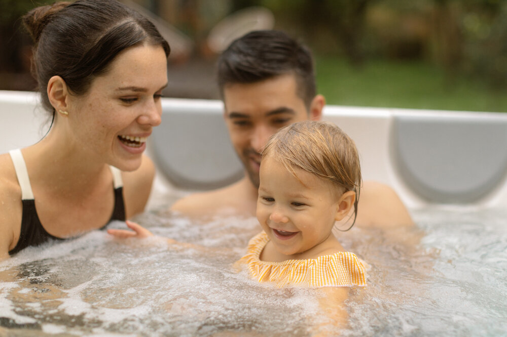 USSPA – family relaxing in spa, serene home wellness atmosphere.