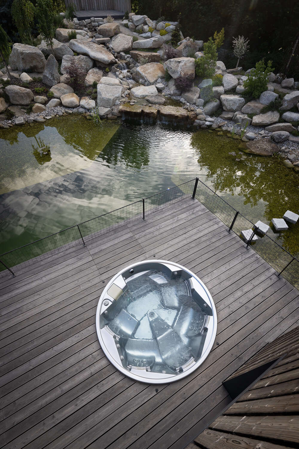 USSPA Orion – a circular hot tub connecting the home and zen garden in perfect harmony with nature.