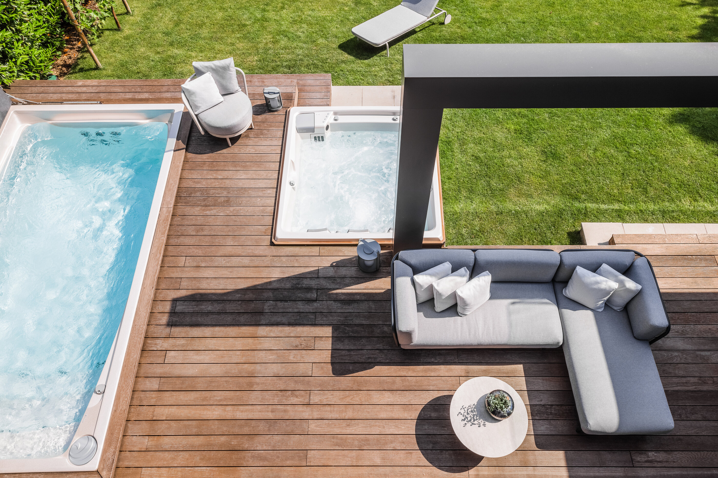 USSPA swim spa with counter-current and outdoor hot tub built into the terrace.