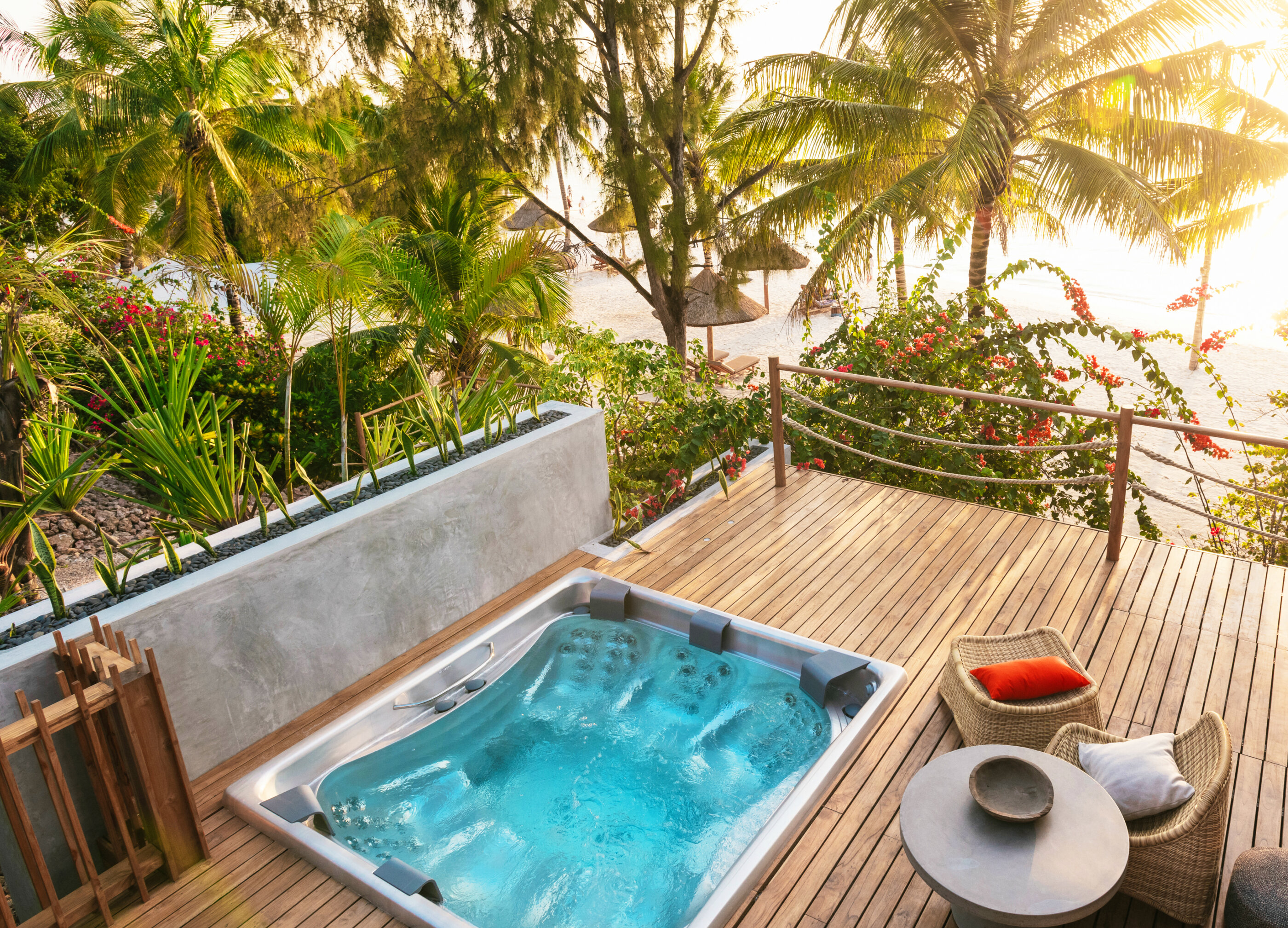 USSPA Master – premium recessed spa with six seats on a Zanzibar terrace overlooking the ocean.