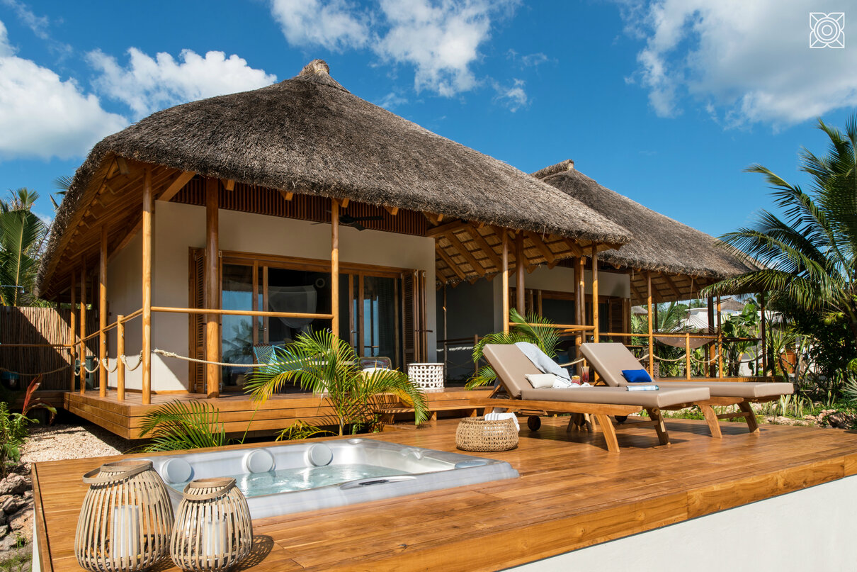 Luxury Zanzibar resort featuring the USSPA Aston hot tub on a terrace overlooking the ocean.