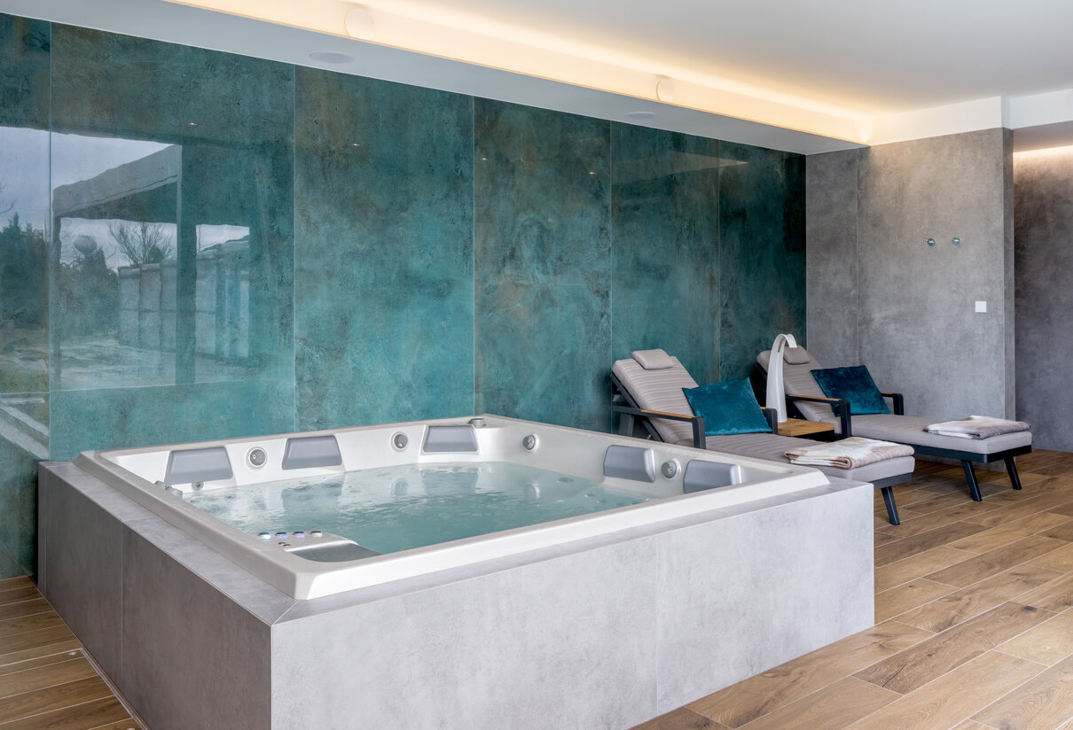 USSPA hot tub with custom cladding that matches the overall interior design.