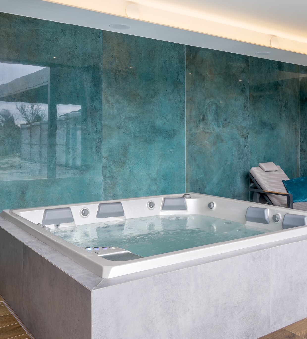 USSPA hot tub with custom cladding that matches the overall interior design.