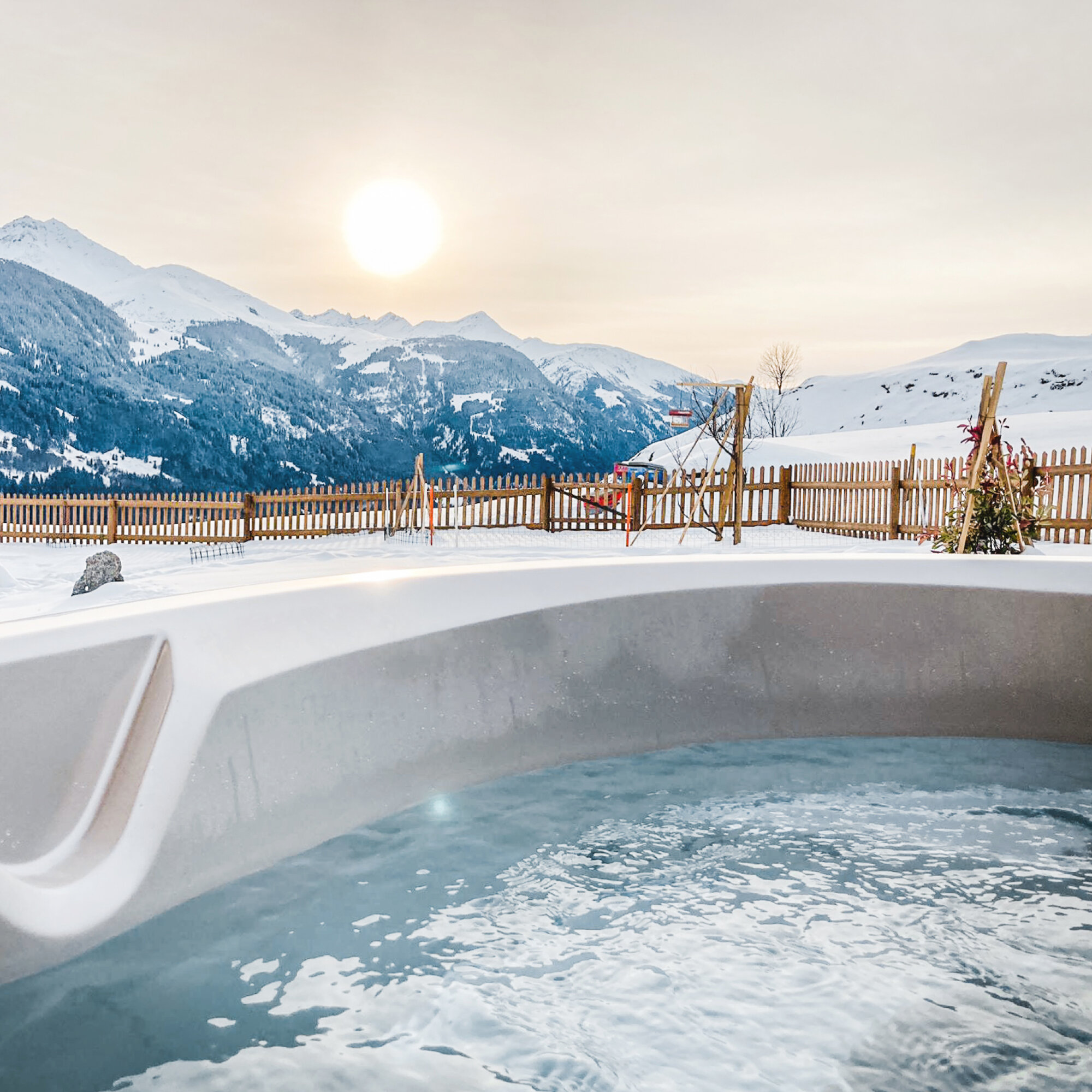 USSPA Taurus iN hot tub in a family house garden with relaxing mountain views.